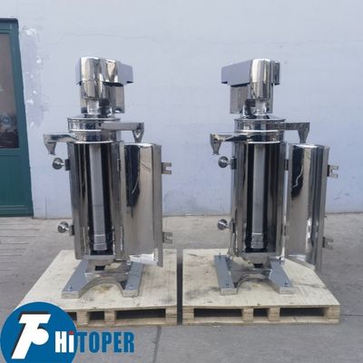 High Capacity Tubular Centrifuge for Liquid Liquid Solid Separation Featuring Effective Gravity Based Phase Discharge System